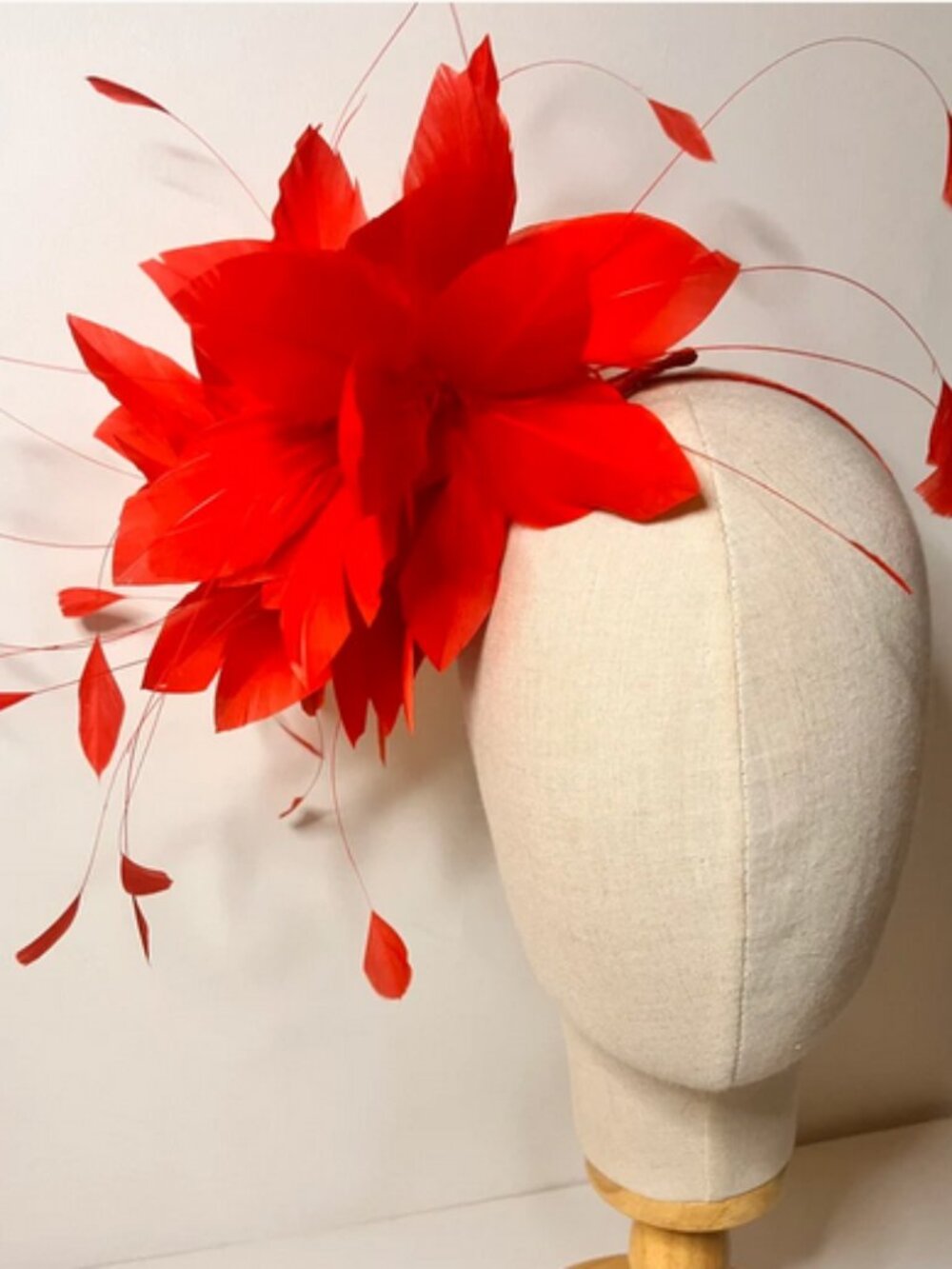 Red feather fascinator